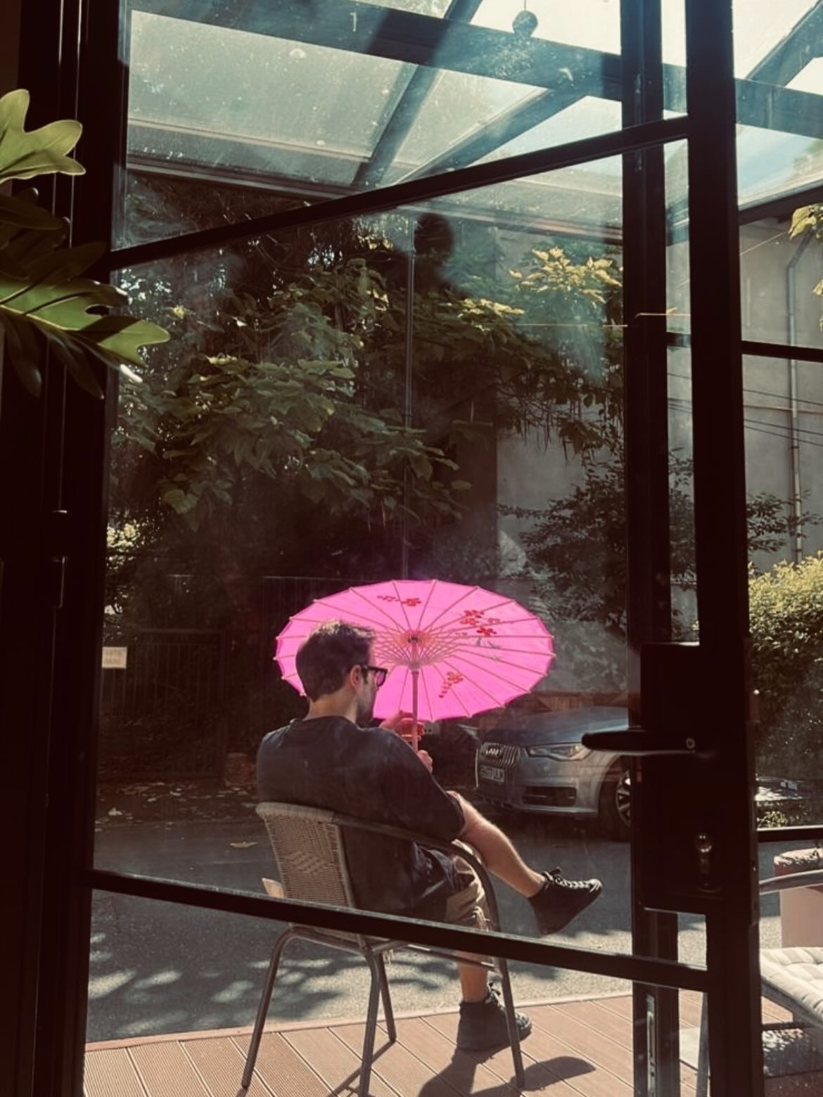 Courtyard with pink parasol — the outdoor terrace